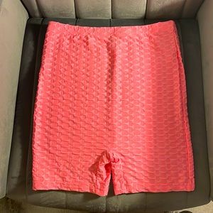 Coral pink shien biker shorts.